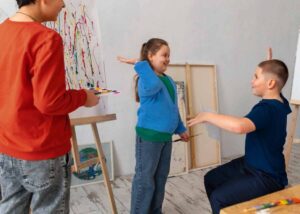 Two children engage in a creative art activity